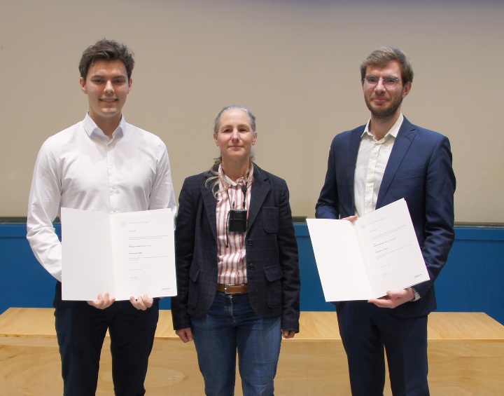 Award ceremony for outstanding graduates in M.Sc. Physics and int. MSc Physics f.l. Philipp Neufeld (1st prize), Prof Daghofer, Kirill Parshukov (2nd prize)