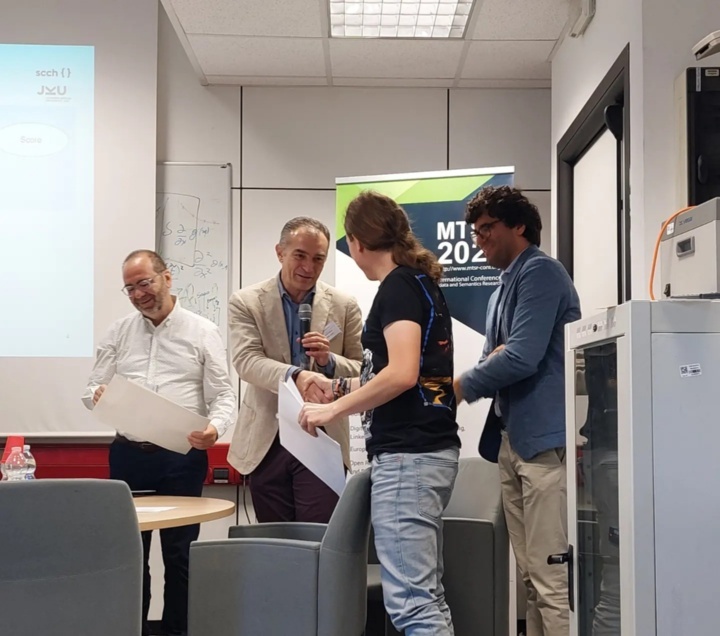 Björn Schembera (second from right) received the certificate for the best paper at MTSR in Milan from Prof. Emmanouel Garoufallou (left), International Hellenic University, Greece, Prof. Fabio Sartori (second from left), University of Milano-Bicocca, Italy, both General Chairs of the conference and from Prof. Marco Savi (right), University of Milano-Bicocca, Italy, MTSR2023 Chair.